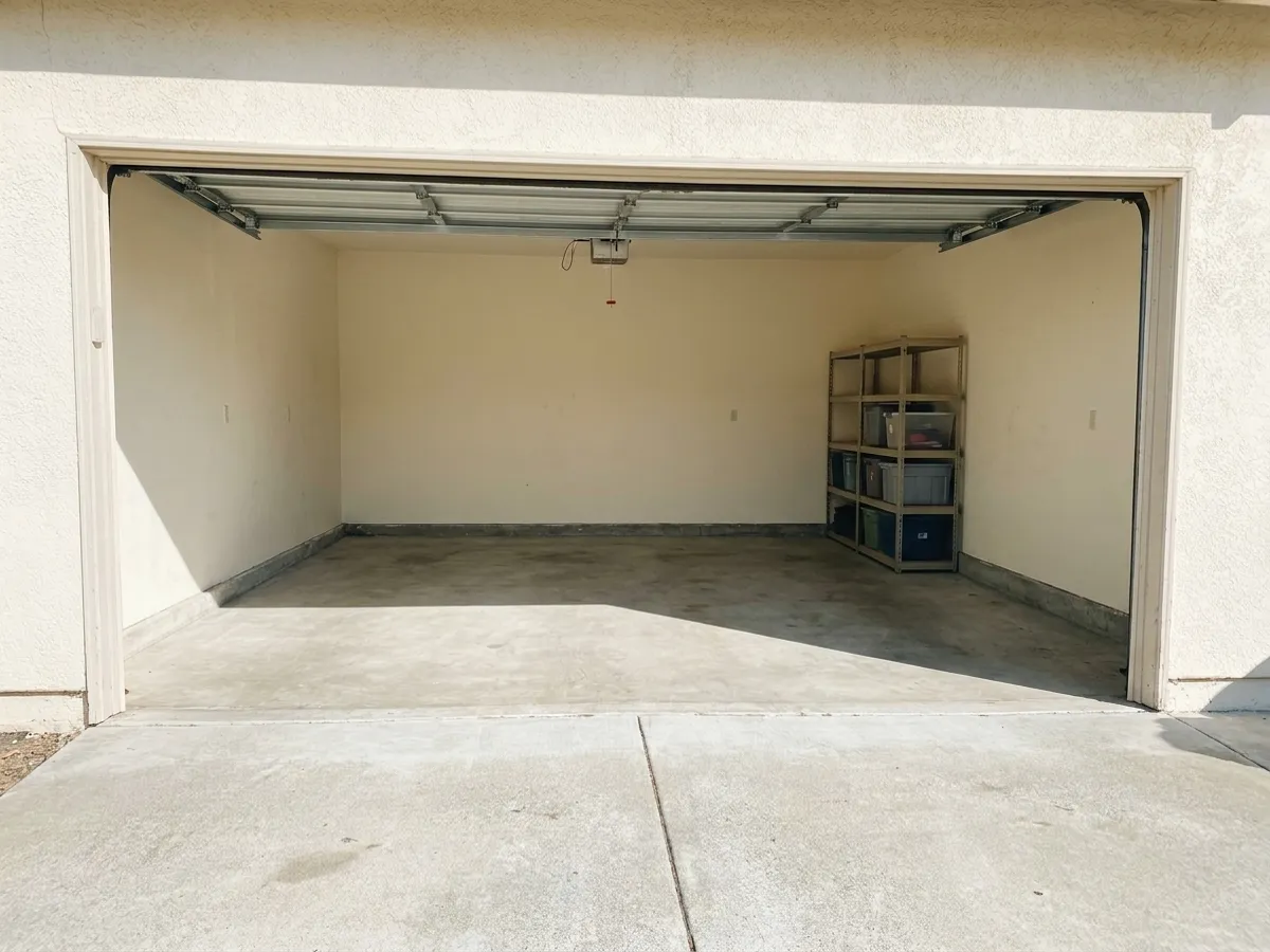 12:00: the same garage swept, with neat shelves