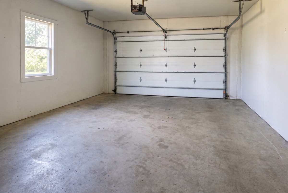The same garage cleared, empty and swept after the haul